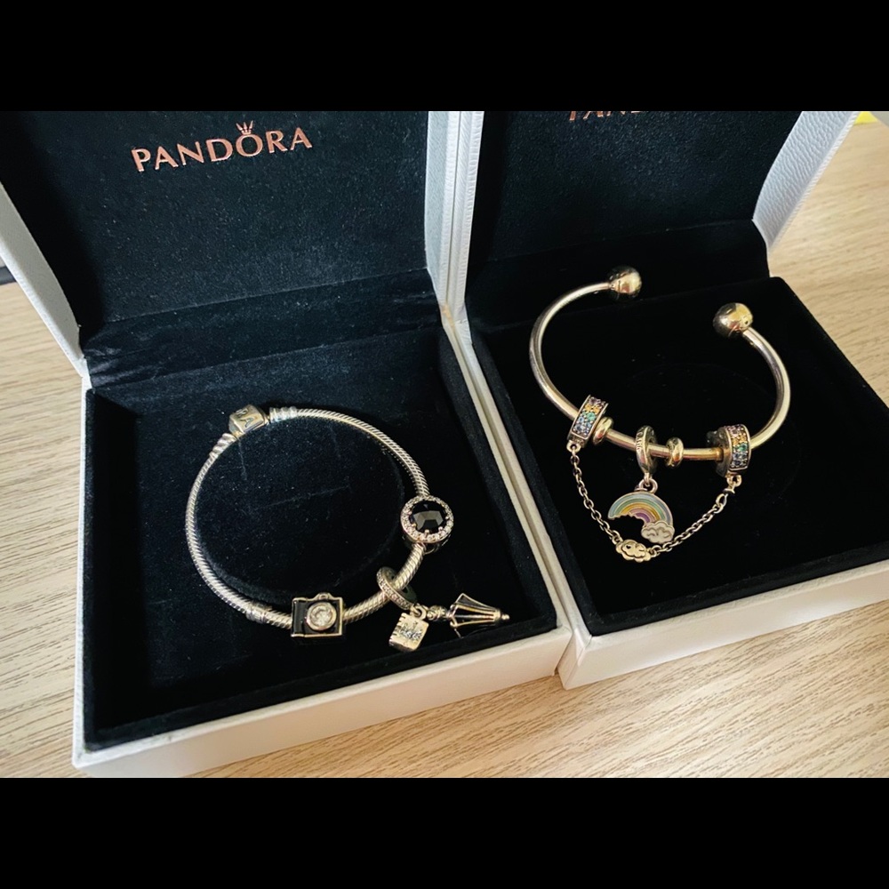 Two Pandora bracelets with charms